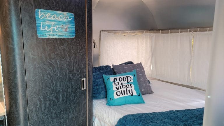 Cozy full-size bed inside the Airstream