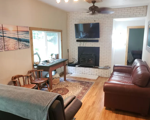 Living room with wood-burning fireplace