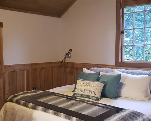 King bedroom with forest view